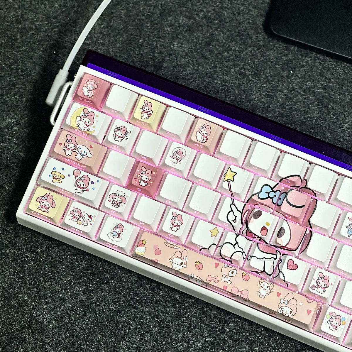 Whimsical My Melody PBT doubleshot backlit keycap set, featuring its pastel pink aesthetic and clean side-printed legends from multiple angles.