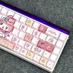 A whimsical gallery of My Melody PBT doubleshot backlit keycaps set in pastel pink, showcasing their clean, side-printed legends from various playful angles.
