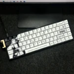 Nako PBT Keycaps set main image, featuring artistic side-engraved original character legends with a clean, backlit PBT aesthetic. Perfect for a minimalist design.