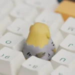 Nudaeng Dog Artisan Keycap displayed from various angles, highlighting its unique handcrafted details, charming cartoon design, and playful setup.