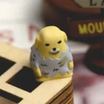 Nudaeng Dog Artisan Keycap from a unique angle, showcasing its charming handcrafted details and playful cartoon design with food elements.