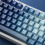 Detailed gallery views of the Ocean Heart PBT Keycap Set, showcasing its deep ocean blues, pristine, aquatic motifs, premium PBT build.