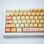 Vibrant Orange Garden PBT Dye-sub Keycaps Set, Nature Set. Detailed views show artistic botanical oranges and foliage from various angles.