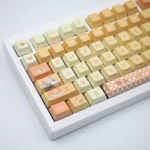 Vibrant Orange Garden PBT Dye-sub Keycaps Set displaying intricate botanical artistry, featuring sun-kissed oranges and lush foliage from various detailed angles.