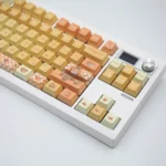 Orange Garden PBT Dye-sub Keycaps Set, shown from various angles, showcasing botanical sun-kissed oranges and lush foliage.