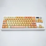 Vibrant Orange Garden PBT Dye-sub Keycaps Set main display, featuring a fresh botanical design with sun-kissed oranges and lush foliage. Artistic keyboard.
