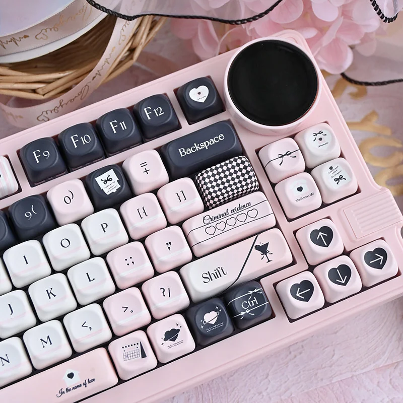 Original Sin Keycap Set in black and pink, showcasing the unique MOA PBT keycaps' dark allure and cute charm from various artistic angles.