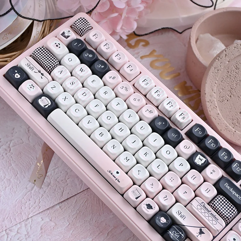 Original Sin Keycap Set displaying unique black and pink MOA profile keycaps. A captivating blend of dark allure and cute charm for an artistic keyboard.