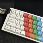 Artistic painted PBT keycaps set for custom mechanical keyboards, displayed from multiple angles, highlighting vibrant, intricate dye-sublimated design.