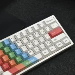 Artistic painted PBT dye-sublimated keycaps set for custom keyboards, vibrant intricate designs shown from diverse angles for personalization.