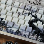 A collection of Ice Core PBT backlit keycaps set, showcasing their elegant ice-themed design and ethereal side-engraved legends from various angles.