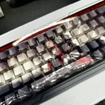 Premium PBT chess keycaps set showcasing a sophisticated monochromatic chessboard pattern and subtle, glowing side-printed legends, optimized for backlit design.