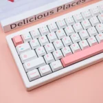 Ice Berry Pink Sky Blue PBT Dye-Sub Keycap Set shown from diverse angles. Highlights durable PBT, crisp dye-sub legends, and refreshing pastel hues.