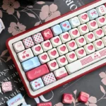 Sweet Cherry PBT keycap set for mechanical keyboards, highlighting the nostalgic pastel design from various playful angles.