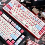 Sweet Cherry PBT Keycap Set for mechanical keyboards, featuring a playful, nostalgic design in soft pastel hues. Durable PBT ensures quality.