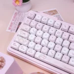 Detailed views of Sweet Milk Candy Pink PBT Keycaps MOA Set, showing charming pastel pink and creamy white rounded keys with an ergonomic MOA profile.