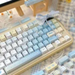 Angled view of Serene 'Seven Parts Blue' PBT Dye-sub Keycaps Set, highlighting tranquil deep blue hues and crisp legends. Premium blue PBT keycaps offer a serene design.