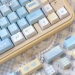 Detailed view of the Serene 'Seven Parts Blue' PBT Dye-sub Keycap Set, showcasing the tranquil deep blue hues and crisp legends from various angles.