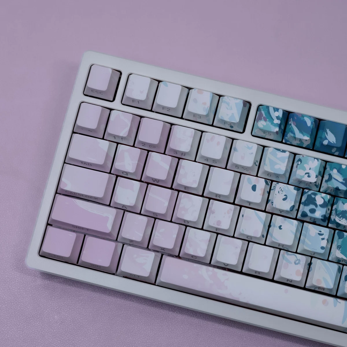 Angled shot of Dreamy Pink Beach PBT keycaps set, featuring soft pink and warm neutral tones. Evokes serene coastal sunsets and durable PBT quality.