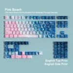 Dreamy Pink Beach PBT keycaps set with crisp English legends, featuring soft pinks and warm neutrals evoking a serene coastal sunset aesthetic.