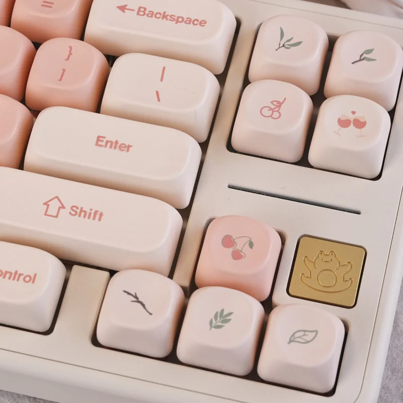 Enchanting Pink Cherry MOA PBT keycaps set showcasing their spherical profile and delicate cherry blossom designs from an artistic top-down perspective angles.
