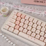Pink Cherry MOA PBT keycaps set shown from multiple angles, highlighting cherry blossoms, soft pink hues, and spherical profile, for retro charm.