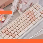 Charming Pink Cherry MOA PBT Keycap Set, beautifully displayed with soft pink hues and delicate cherry blossom motifs on spherical keycaps.