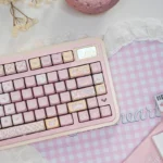 Playful pink PBT Pixel Cat Keycaps set, shown from various angles, highlighting the adorable pixel art design and durable quality.