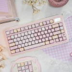 Adorable pink Pixel Cat PBT keycaps set, shown from various angles, highlighting the charming pixel art design and durable PBT material.
