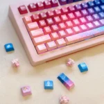 Vibrant Pixel Space PBT Dye-sub Keycaps set, showcasing various angles and retro cosmic pixel art designs for an 8-bit space exploration aesthetic.