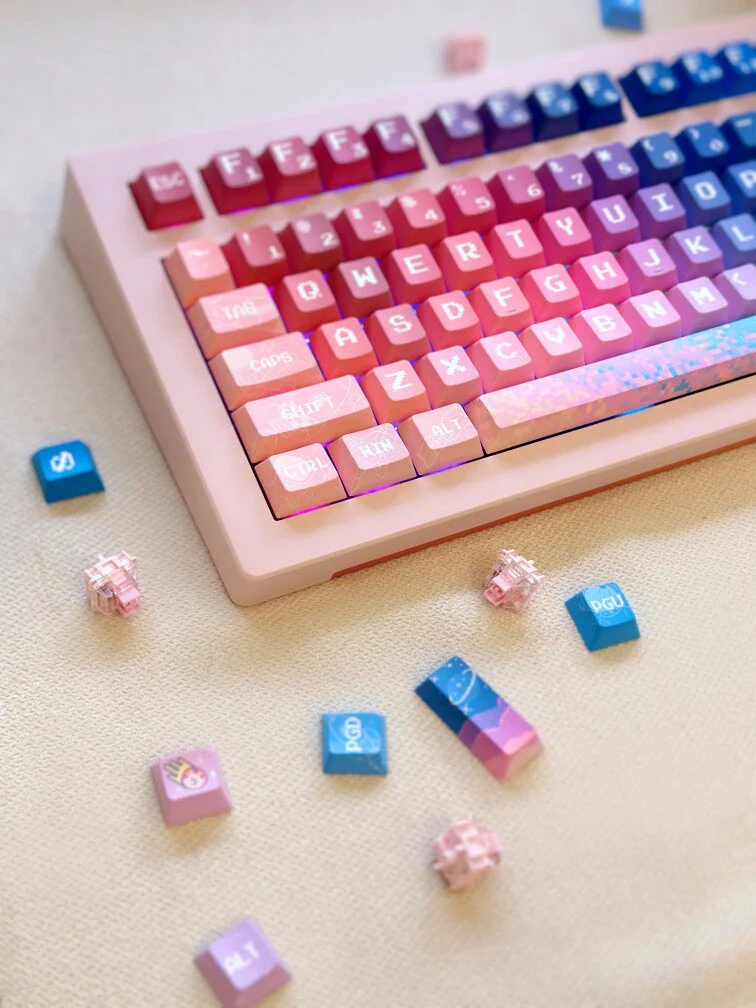 Vibrant Pixel Space PBT Dye-sub Keycaps set, showcasing various angles and retro cosmic pixel art designs for an 8-bit space exploration aesthetic.