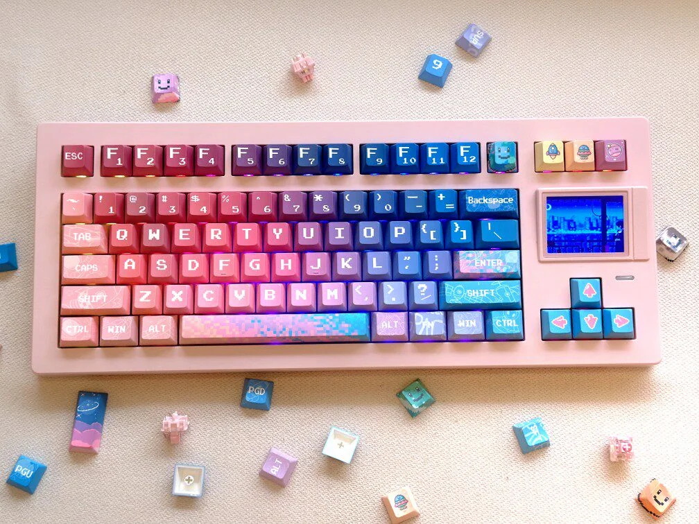 Vibrant Pixel Space PBT Dye-sub Keycaps set, showcasing retro cosmic 8-bit art for mechanical keyboards, a unique artistic accessory.