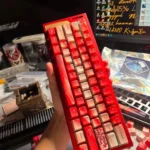 A full set of durable PBT Plum Blossom Keycaps Set, featuring exquisite dye-sublimated red plum blossom art from various serene angles.