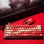 Close-up of durable PBT plum blossom keycaps set, showcasing vibrant red dye-sublimated art for a 68-key mechanical keyboard layout, evoking traditional design.