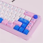 An artistic gallery view of the POCO blue and pink PBT dye-sub keycaps set, showcasing their unique dye-sublimation and adorable aesthetic.