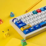 Vibrant Pixel Odyssey Pokemon PBT keycaps set, showcasing detailed 8-bit pixel art of iconic Pokemon from different angles. Durable and retro-inspired.
