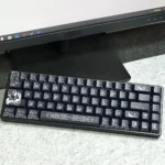 Angled view of the majestic Poseidon keycap set, revealing the intricate hand-sculpted details of the ocean deity and the artistic quality.