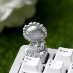 PvZ Sunflower Trophy Artisan Keycap, highlighting vibrant gold and silver finishes from various angles. An iconic PvZ collectible gaming keycap.