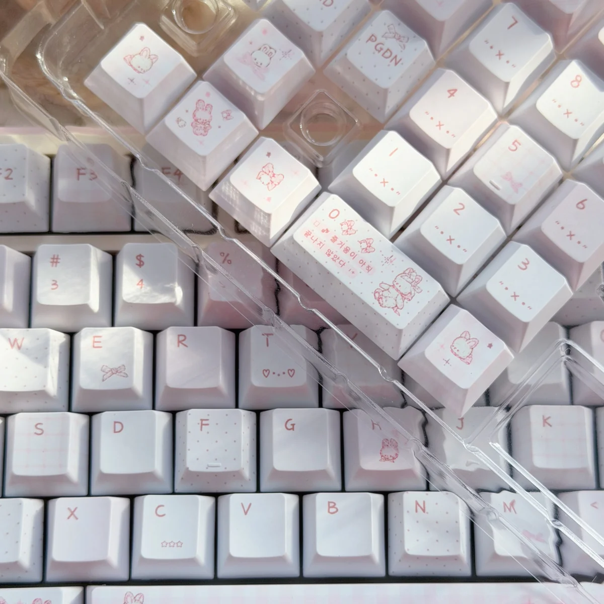 Charming PBT Rabbit Bear Story Keycaps set, showcasing various angles of the unique pastel illustrations for a whimsical keyboard upgrade.