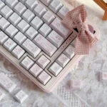 Charming Rabbit Bear Keycaps Set displayed from multiple angles, highlighting their unique PBT story with whimsical pastel illustrations and a playful nature design.