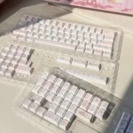 Explore the unique Rabbit Bear Keycaps PBT story set from multiple angles, highlighting charming pastel illustrations of the whimsical rabbit and bear.