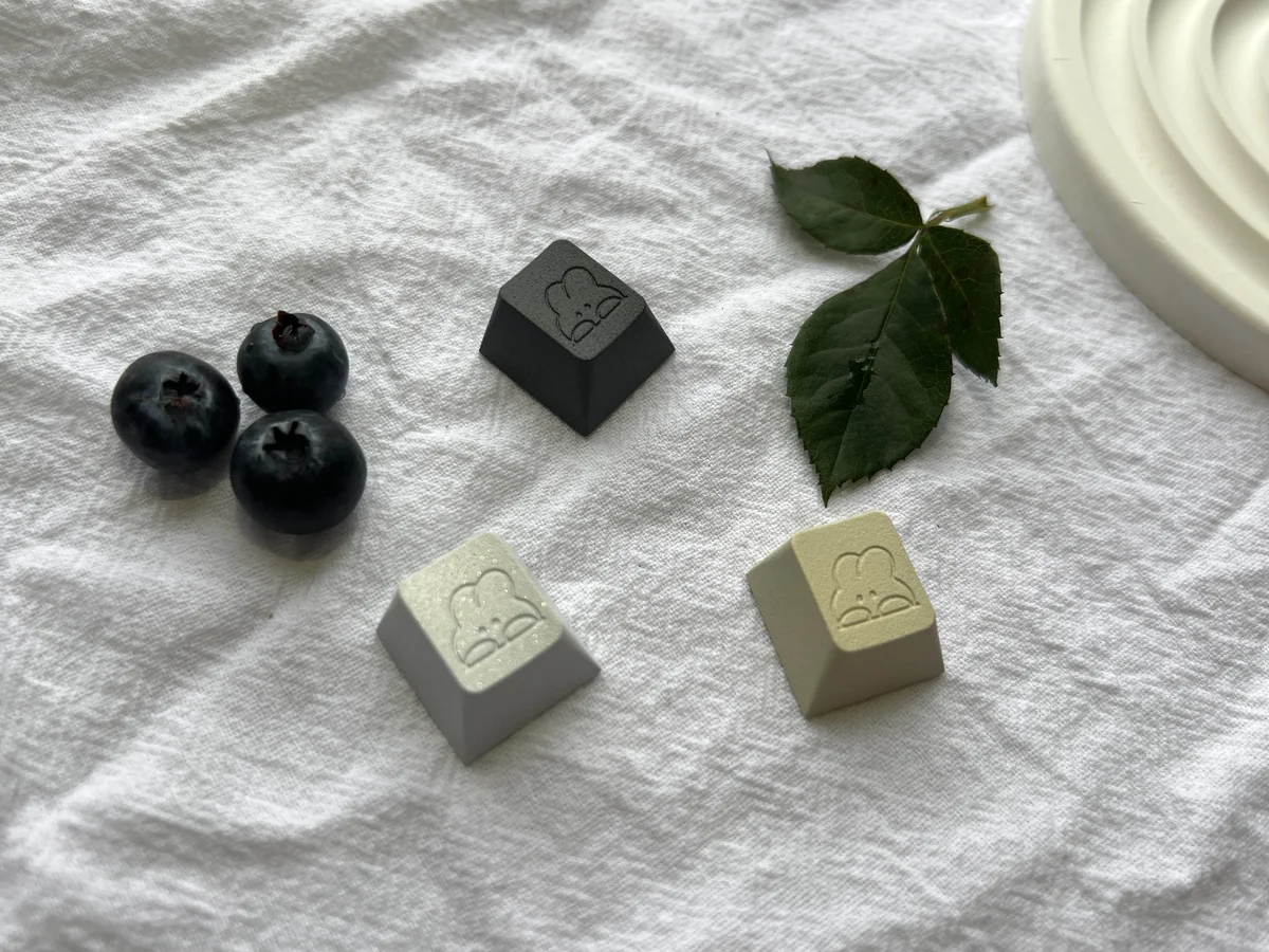 Gallery view of the premium aluminum adorable rabbit keycap, highlighting its charming pastel finish and intricate design from various angles.