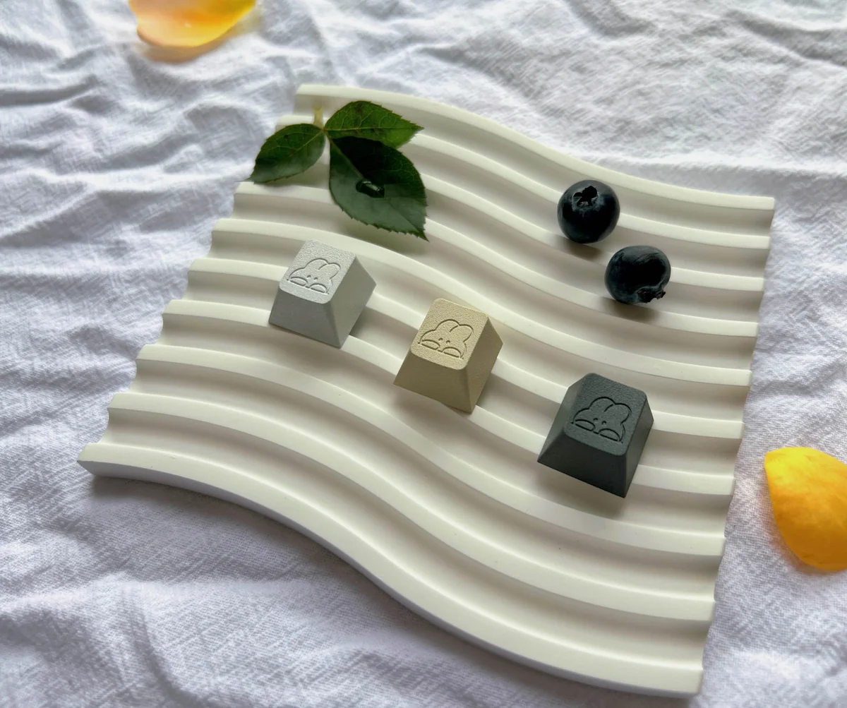 Close-up of an adorable rabbit keycap, showcasing its premium polished aluminum and charming pastel, dessert-inspired design for ESC R4.