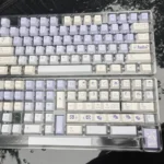 Whimsical rabbit PBT keycap set, showcasing vibrant dye-sublimated art on durable PBT from a captivating, detailed angle.