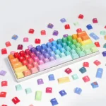A collection of vibrant Rainbow PBT Keycaps Set, showcasing their ergonomic design and dye-sublimated durability from multiple angles.