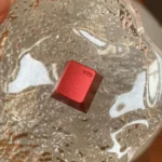 Gallery of a premium vibrant red aluminum R4 mechanical keycap, showcasing its intricate whimsy design from multiple artistic angles.