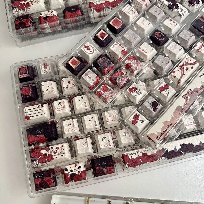 A close-up view of the Red and Black Rose PBT Dye-Sub Keycap Set, revealing its intricate floral patterns, durable texture, and dramatic gothic elegant.