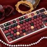 Regal Red Heart Queen PBT Dye-Sub MOA keycap set from various angles, showcasing stunning red and black, intricate card suit designs.
