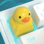 Main image of a handcrafted resin Playful Duck Keycap, featuring an adorable little yellow duck for whimsical keyboard charm.