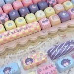 Vibrant Rikka Takanashi anime keycaps set, a whimsical MOA set showcasing character art, playful iconography, and delicate floral accents from a distinctive design.
